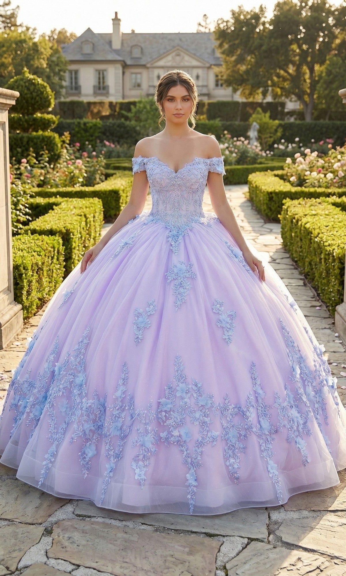 A woman stands in a garden wearing the Quinceanera Dress CHF3124 By Chicas—a lilac off-the-shoulder ballgown adorned with blue 3D floral accents and featuring a full tulle skirt.